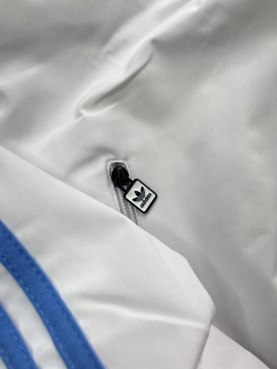 Retro White Track Jacket with Blue Stripes – Adidas-Inspired Athletic Windbreaker | Vintage Sportswear Style